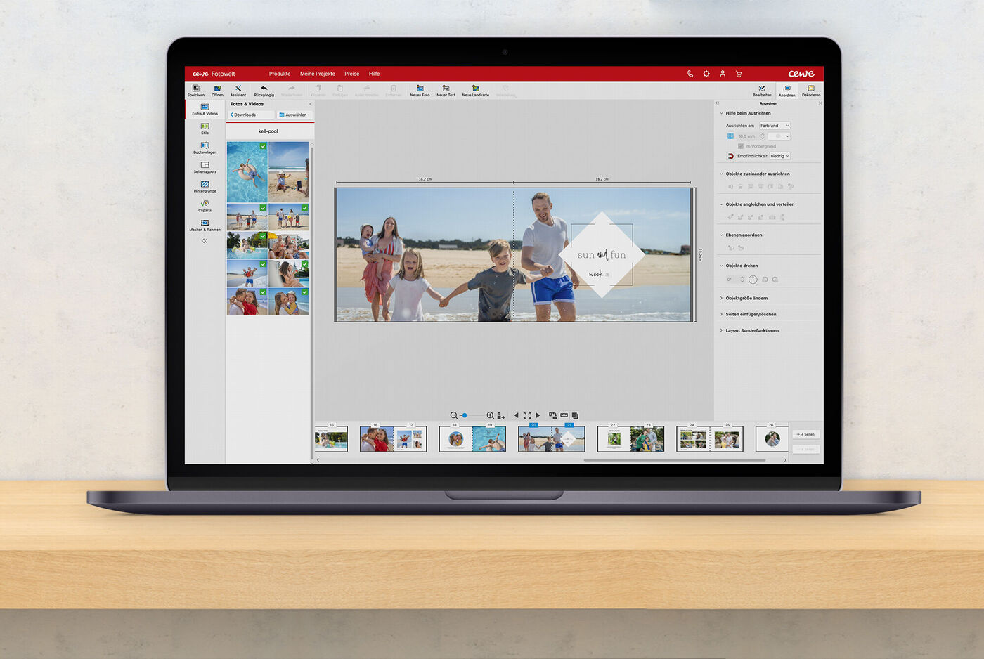 Una persona utilizza il software CEWE Fotolibro su un laptop.