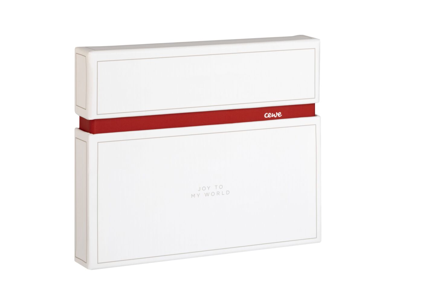Elegante scatola regalo CEWE bianca con nastro rosso, contrassegnata 'Joy to my World'