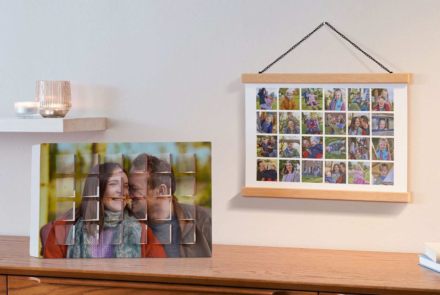 Un libro fotografico CEWE e un quadro con foto di famiglia su un tavolo, circondati da un'atmosfera calda